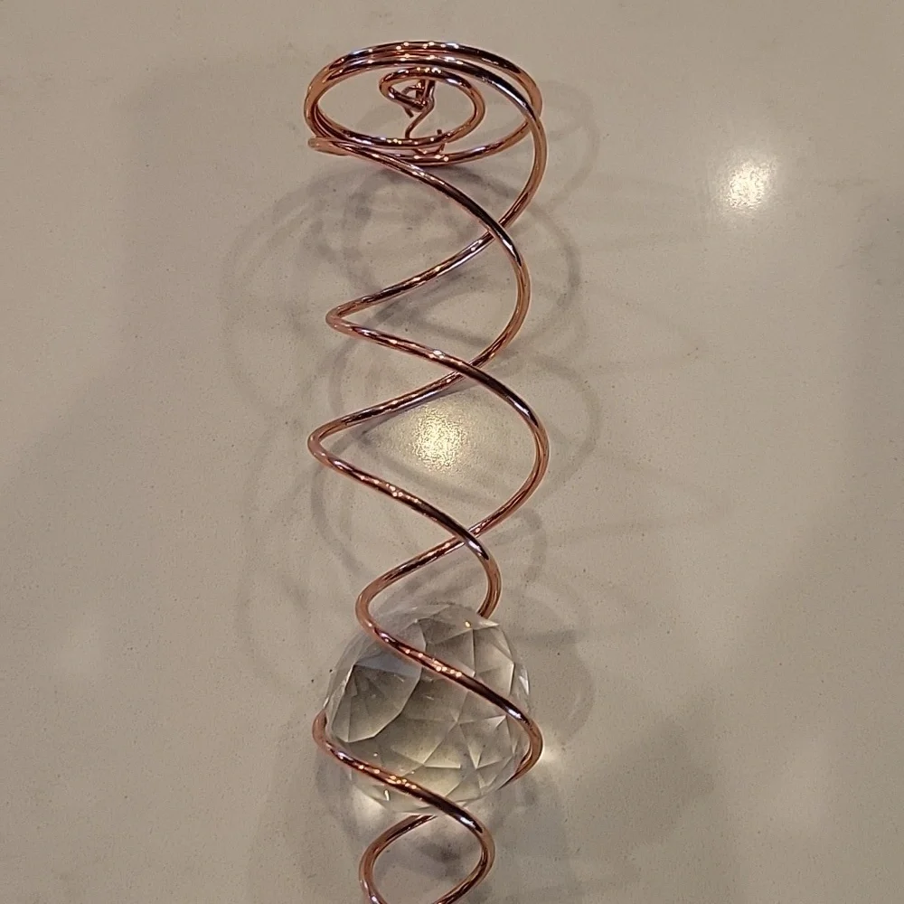 Elegant Copper Spiral Ornament with Crystal Accents